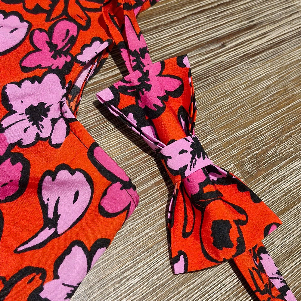 Untitled Image of a red and pink bowtie matched to the material of a dress